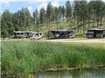 RV sites near the pond at Custer's Gulch RV Park & Campground - thumbnail