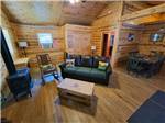 Cabin living room and dining area at Custer's Gulch RV Park & Campground - thumbnail