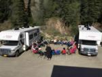 Campers in a circle at site - thumbnail