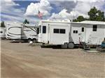 A row of travel trailers at SKY UTE FAIRGROUNDS & RV PARK - thumbnail