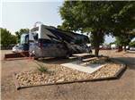 A motorhome in a pull thru RV site at FORT AMARILLO RV RESORT - thumbnail