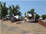 View larger image of A motorhome in a pull thru RV site at FORT AMARILLO RV RESORT image #6