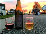 View larger image of Wine glasses on street with a group of people in the back at WINE COUNTRY RV PARK image #1