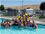View larger image of People swimming in pool at WINE COUNTRY RV PARK image #5