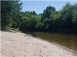 Sand next to the river at SCHROON RIVER CAMPGROUND & LODGING - thumbnail