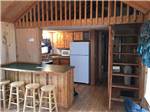 The kitchen area in the cabin rental at SCHROON RIVER CAMPGROUND & LODGING - thumbnail
