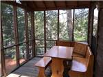 A nook on the deck of a cabin at SCHROON RIVER CAMPGROUND & LODGING - thumbnail