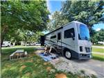 A motorhome in an RV site at WHITE ACRES CAMPGROUND - thumbnail