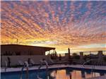 The swimming pool at sunset at SONORAN DESERT RV PARK - thumbnail