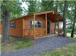 View larger image of Log cabin at TWIN GROVE RV RESORT  COTTAGES image #3