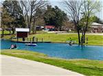 View larger image of People paddling in the lake at MILL CREEK RANCH RESORT image #8