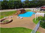 View larger image of Swimming pool and nearby fire pit at MILL CREEK RANCH RESORT image #12