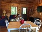 Dining and living areas in a cabin - thumbnail