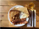 A plate of bacon, eggs, and toast at VIKING RV PARK - thumbnail