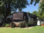 A Class A motorhome parked in a paved site at CHERRY HILL MH & RV COMMUNITY - thumbnail