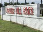 The metal park name sign on the brick wall at CHERRY HILL MH & RV COMMUNITY - thumbnail