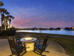 Seating around a firepit at sunset at Lakeview RV Resort - thumbnail