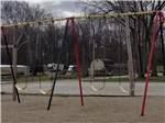 The colorful swing set at MUNCIE RV RESORT BY RJOURNEY - thumbnail