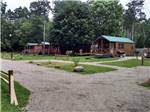 The wooden rental cabins at MUNCIE RV RESORT BY RJOURNEY - thumbnail
