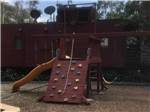 The train shaped playground equipment at MIDWAY RV PARK - thumbnail
