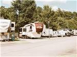 View larger image of A long row of occupied RV sites at LAKESIDE RV PARK image #12