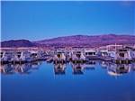 View larger image of Houseboats docked on the blue water at COTTONWOOD COVE NEVADA RV PARK  MARINA image #1
