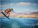View larger image of A girl wake surfing high in the air at COTTONWOOD COVE NEVADA RV PARK  MARINA image #4