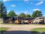 Two motorhomes parked in gravel sites at CANTON I-20 RV PARK - thumbnail