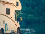 A Class C motorhome parked by the river - thumbnail