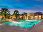 View larger image of The swimming pool lit up at night at THE SPRINGS AT BORREGO RV RESORT  GOLF COURSE image #9