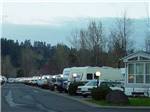 View larger image of A row of full RV sites at SANDY RIVERFRONT RV RESORT image #12