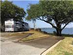 View larger image of Motorhome overlooking water in campsite at SUNSET POINT ON LAKE LBJ image #1