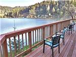 A wooden deck overlooking the water at LOON LAKE LODGE & RV RESORT - thumbnail