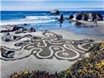Designs in the sand at the beach at BANDON BY THE SEA RV PARK - thumbnail