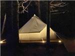 The view of a large tent at night at OCEAN RIVER RV RESORT & CAMPGROUND - thumbnail