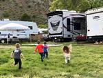 Kids playing by campsites at Big Rock Candy Mountain Resort - thumbnail
