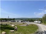 View larger image of A group of gravel RV sites at ADVENTURES EAST CAMPGROUND  COTTAGES image #9