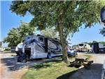 Shady campsite with motorhome at LAKE HAVEN RETREAT - thumbnail