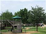 Play structure with swingset at TEXAN RV RANCH - thumbnail