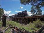 View larger image of The train crossing the bridge at GRAND CANYON RAILWAY RV PARK image #11