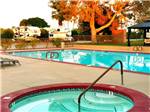 Pool area with RVs in background at Shadow Hills RV Resort - thumbnail