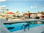 Swimming pool with outdoor seating at ENCORE MESA VERDE - thumbnail