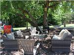 An outdoor seating area near the playground at ARBUCKLE RV RESORT - thumbnail