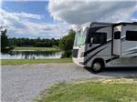 A motorhome driving on one of the gravel roads at ROCKY HOCK CAMPGROUND - thumbnail