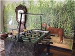 A foosball table in the rec room at POCHE PLANTATION RV RESORT - thumbnail