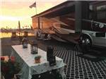 View larger image of A motorhome on the water at sunset at MISSION BAY RV RESORT image #8