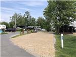A paved pull thru RV site at CAMPING LA CLE DES CHAMPS RV RESORT - thumbnail