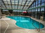 The screened in swimming pool at EVERGREEN PARK RV RESORT - thumbnail