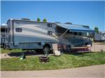 A motorhome with it's awning out at EVERGREEN PARK RV RESORT - thumbnail