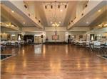 Dining area with stage and dance floor at WILLISTON CROSSINGS RV RESORT - thumbnail